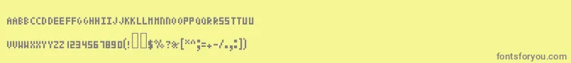 Police Pixeltext – polices grises sur fond jaune