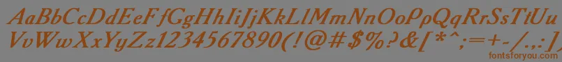 フォントAcademy2 – 茶色の文字が灰色の背景にあります。