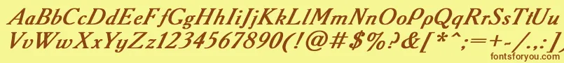 フォントAcademy2 – 茶色の文字が黄色の背景にあります。