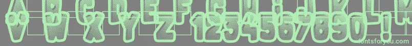 FluoGums-Schriftart – Grüne Schriften auf grauem Hintergrund