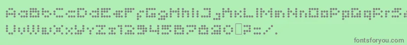 Imajix16Dot-fontti – harmaat kirjasimet vihreällä taustalla