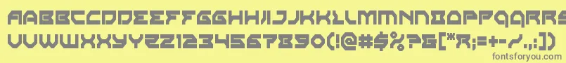 フォントXenodemoncond – 黄色の背景に灰色の文字