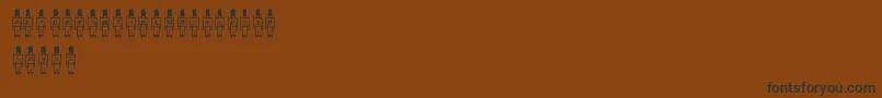 Czcionka LmsToySoldier – czarne czcionki na brązowym tle