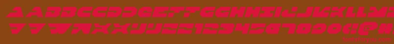 フォントTriggermanexpandital – 赤い文字が茶色の背景にあります。