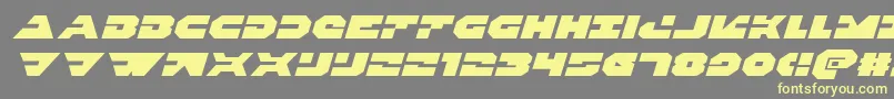Triggermanexpandital Font – Yellow Fonts on Gray Background