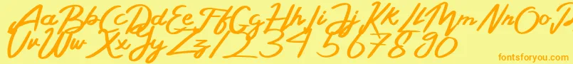 Czcionka BelladaPersonalLicense – pomarańczowe czcionki na żółtym tle