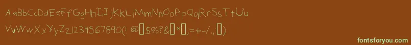 フォントChildSerialKiller – 緑色の文字が茶色の背景にあります。