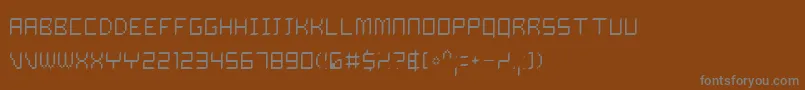 フォントDalil – 茶色の背景に灰色の文字