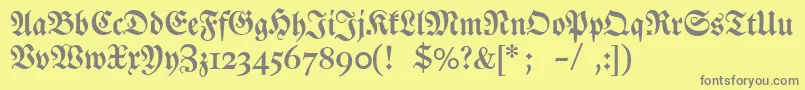 Dslutherschehalbfett-fontti – harmaat kirjasimet keltaisella taustalla