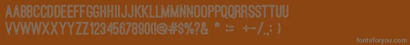 フォントOstrichsansBold – 茶色の背景に灰色の文字