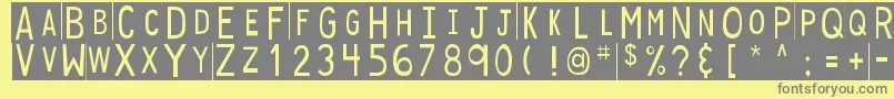 DjbStickyTapeLabelsStrips-Schriftart – Graue Schriften auf gelbem Hintergrund