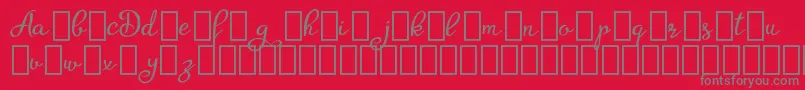 AgrishDemo-fontti – harmaat kirjasimet punaisella taustalla