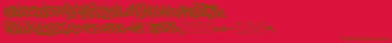 Fonte UrbanCalligraphy – fontes marrons em um fundo vermelho