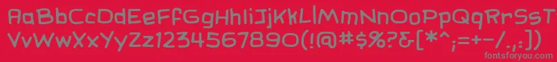 SundaycomicsbbReg-fontti – harmaat kirjasimet punaisella taustalla