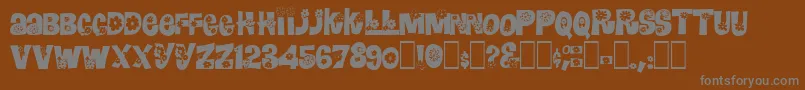 Czcionka RomashulkaNormal – szare czcionki na brązowym tle