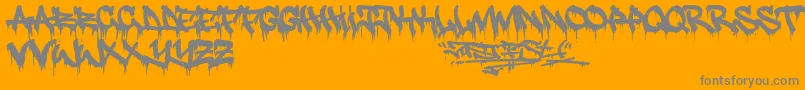 Justfist2-Schriftart – Graue Schriften auf orangefarbenem Hintergrund