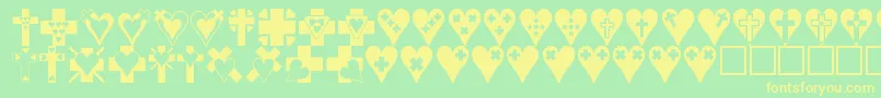 フォントCrossesnhearts – 黄色の文字が緑の背景にあります