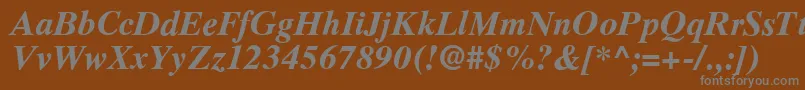 RomanelevenBold-fontti – harmaat kirjasimet ruskealla taustalla