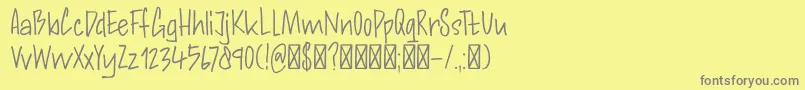 Police DkAndorraScript – polices grises sur fond jaune