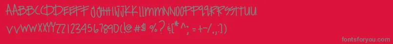 フォントExpensivehabits – 赤い背景に灰色の文字