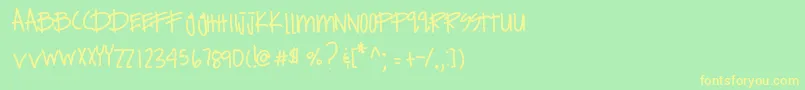 フォントExpensivehabits – 黄色の文字が緑の背景にあります