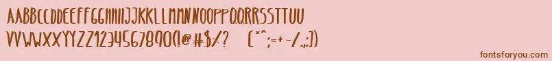 BeltaBold-Schriftart – Braune Schriften auf rosa Hintergrund
