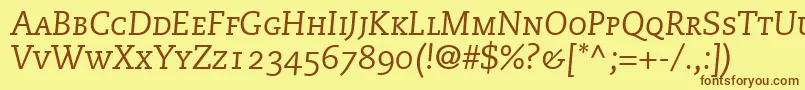 フォントMonologueCapsSsiItalicSmallCaps – 茶色の文字が黄色の背景にあります。