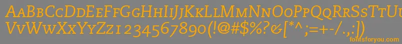 フォントMonologueCapsSsiItalicSmallCaps – オレンジの文字は灰色の背景にあります。