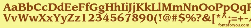 フォントLeawoodstdBold – 茶色の文字が黄色の背景にあります。