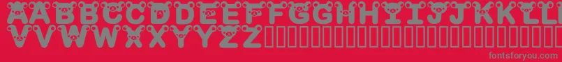 フォントRilakkumadingbatBold – 赤い背景に灰色の文字