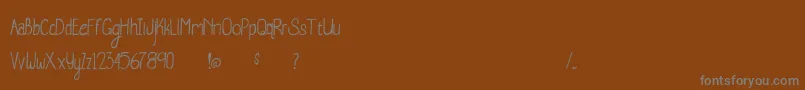 Czcionka WhaleWatching – szare czcionki na brązowym tle