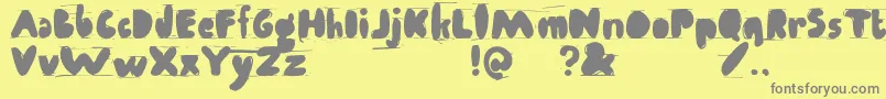 Antibalon-fontti – harmaat kirjasimet keltaisella taustalla