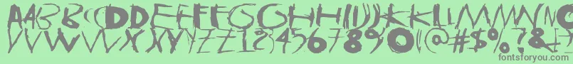 フォントTasapainoaistiIso – 緑の背景に灰色の文字