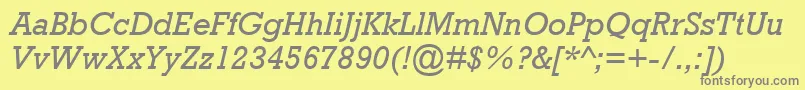 AstuteSsiItalic-fontti – harmaat kirjasimet keltaisella taustalla