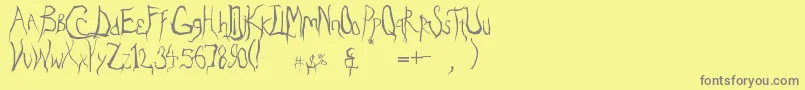 フォントEradicate – 黄色の背景に灰色の文字