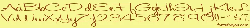 フォントAboutface33RegularTtext – 茶色の文字が黄色の背景にあります。