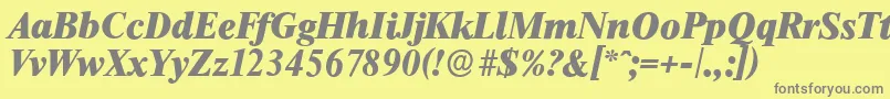 ThamesserialHeavyItalic-fontti – harmaat kirjasimet keltaisella taustalla
