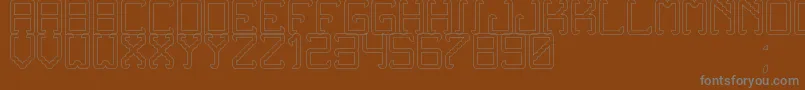 Шрифт NoxtreyAufTfbHollow – серые шрифты на коричневом фоне