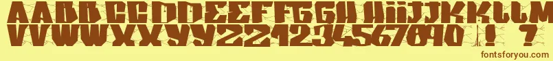 フォントArakphobia – 茶色の文字が黄色の背景にあります。