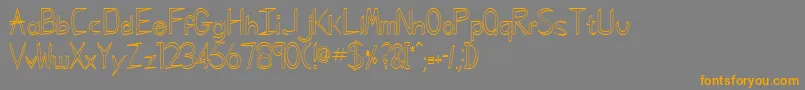 フォントGregorianHollowNormal – オレンジの文字は灰色の背景にあります。