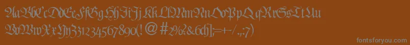 ProfidbNormal-fontti – harmaat kirjasimet ruskealla taustalla