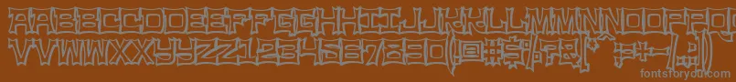 Ninjaline-Schriftart – Graue Schriften auf braunem Hintergrund