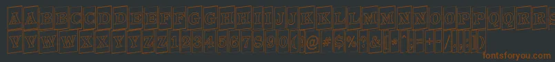 ATrianglercmotlup-Schriftart – Braune Schriften auf schwarzem Hintergrund