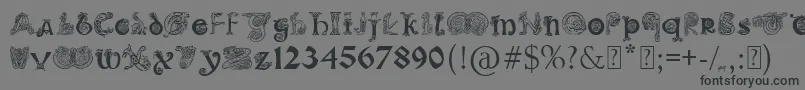 フォントPaulsIlluminatedCelticFont – 黒い文字の灰色の背景