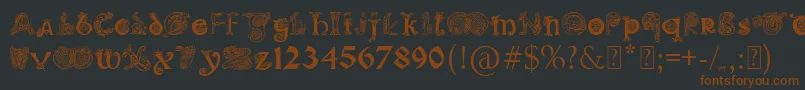 フォントPaulsIlluminatedCelticFont – 黒い背景に茶色のフォント