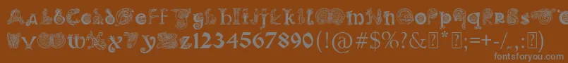 Шрифт PaulsIlluminatedCelticFont – серые шрифты на коричневом фоне