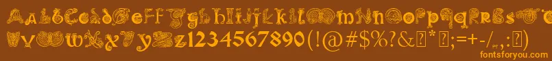 フォントPaulsIlluminatedCelticFont – オレンジ色の文字が茶色の背景にあります。