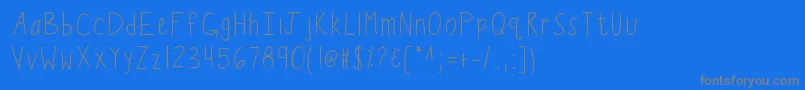 Saiba mais sobre a fonte Kbwiggleworm Fonte Kbwiggleworm – fontes cinzas em um fundo azul