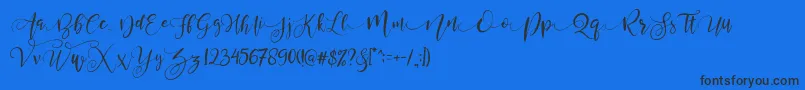 ValledofasJustPersonalOnly-Schriftart – Schwarze Schriften auf blauem Hintergrund