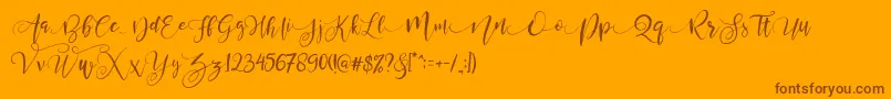 ValledofasJustPersonalOnly-fontti – ruskeat fontit oranssilla taustalla